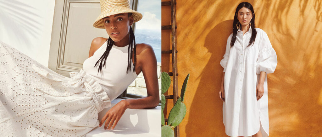 two women wearing white posing