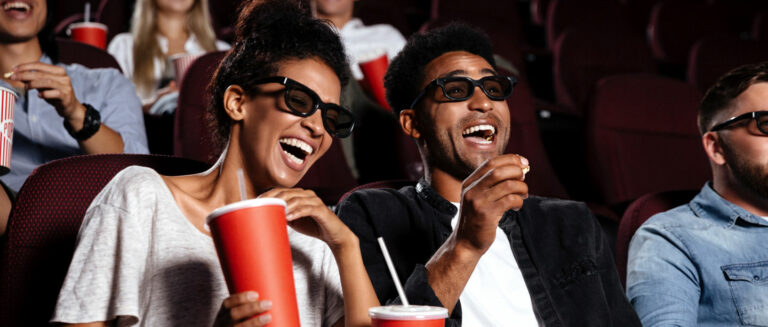 couple watching a movie laughing