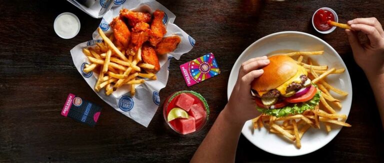 Dave and Buster's burger with wings and fries